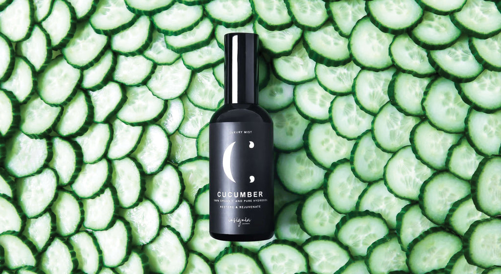Insignia London Organic Cucumber Face Mist 100ml black bottle labeled Cucumber on bed of sliced cucumbers.
