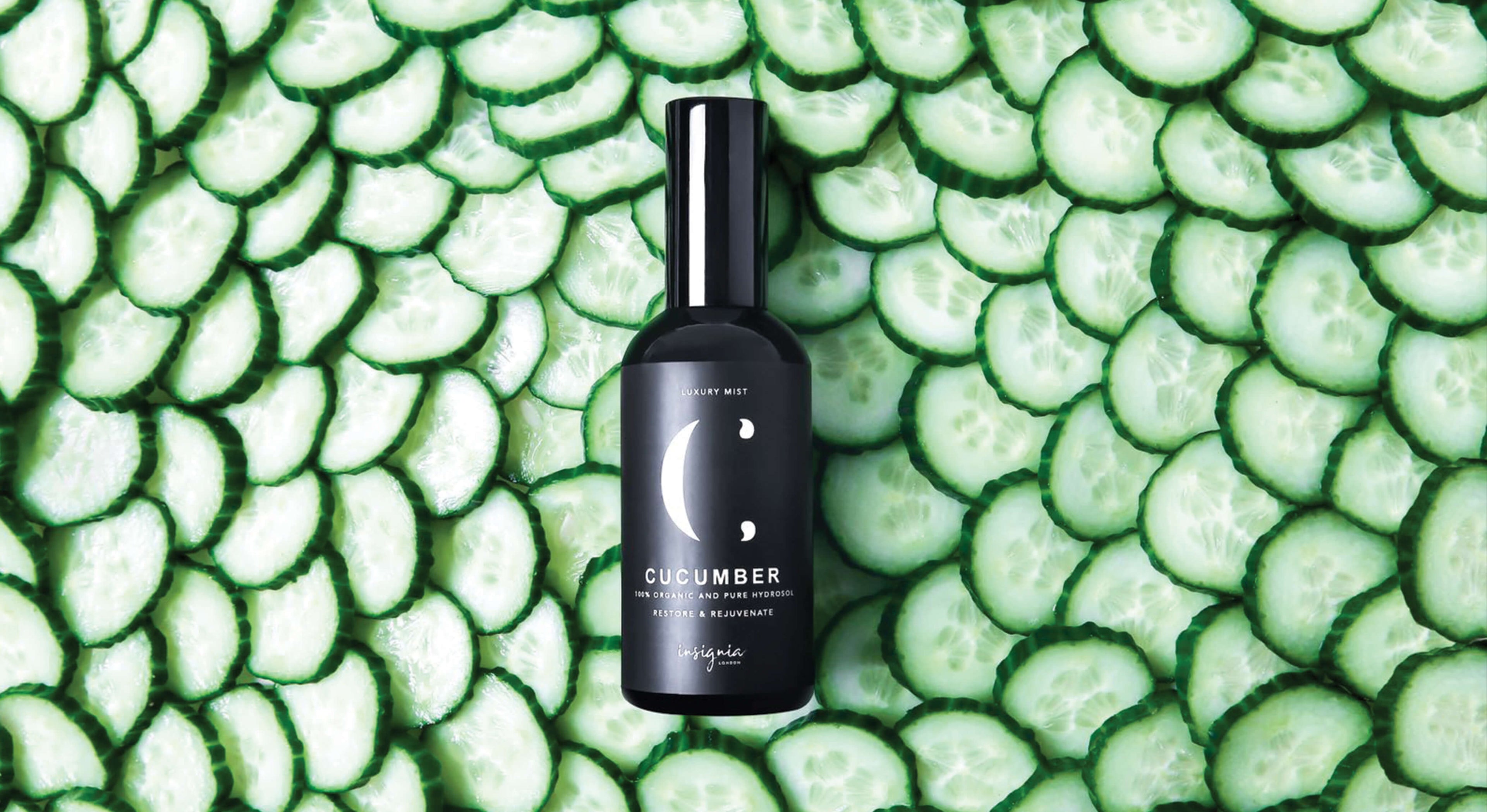 Insignia London Organic Cucumber Face Mist 100ml black bottle labeled Cucumber on bed of sliced cucumbers.